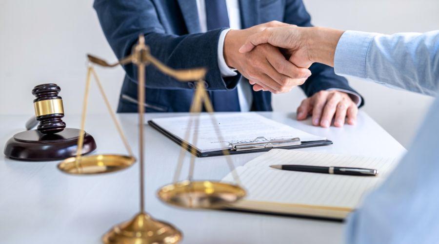 a lawyer shaking hands with a man