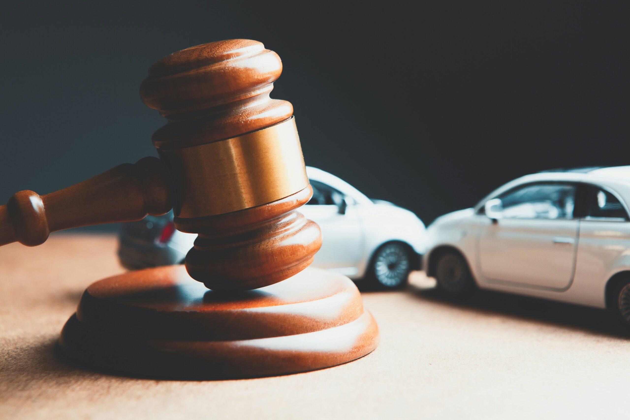 car crash next to legal gavel